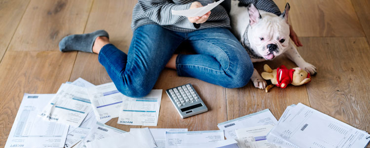 Woman looking through papers - Maintaining Your Financial Records